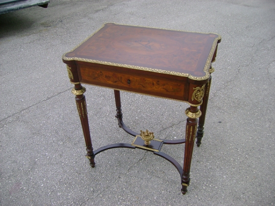 Small antique table repaired and restored.
polished brass hardware
